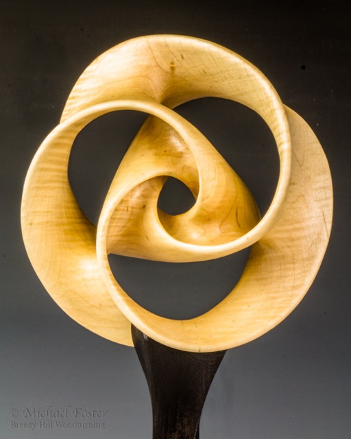 Involute-  Curly Red Maple, 7.5&rdquo; x 3.25&rdquo;, Waterlox.  Stand is Cherry with Black leather dye.  18&rdquo; H with stand.----SOLD