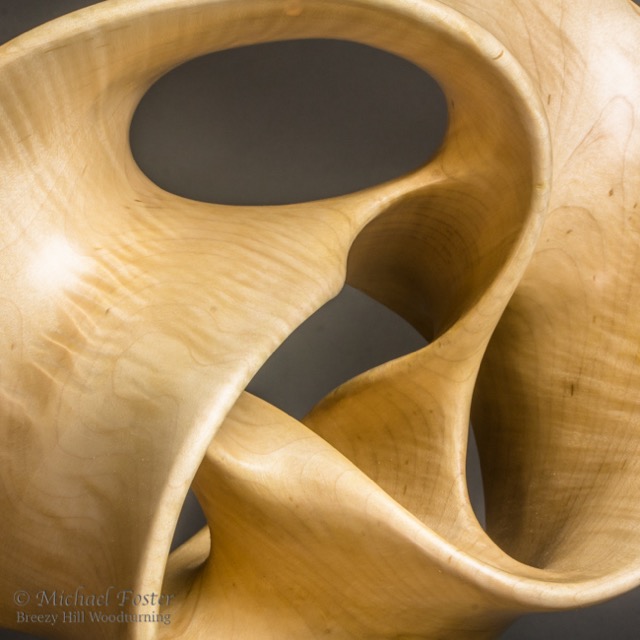 Lost In Space-   Turned as a torus, then carved.  All that is left of the torus is the edge of the form.----SOLD