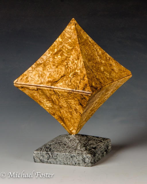 Octahedron-   An polyhedron composed of 8 identical equilateral triangles featuring an interior spherical box.----AVALIABLE