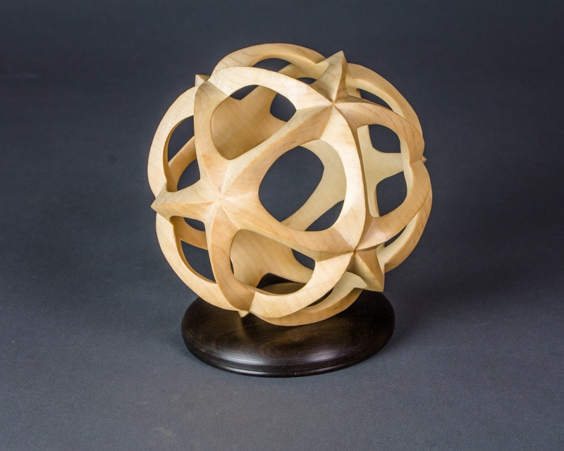 Network-   A piece that started as a sphere, but then hollowed on 20 axes an subsequently carved to final shape----SOLD