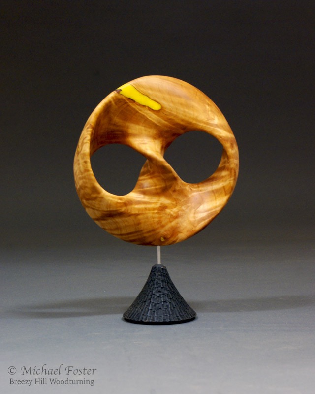 Infinite Loop-   A trefoil knot minimal surface.  The edges of the piece trace out a trefoil knot, and the wood joins those edges in a minimal surface.----AVAILABLE